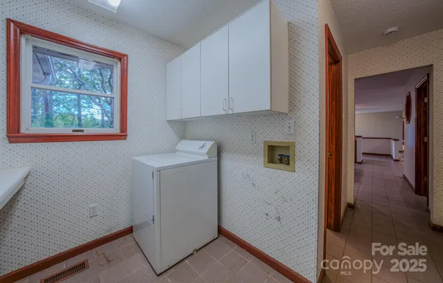 an empty room with furniture and a ceiling fan