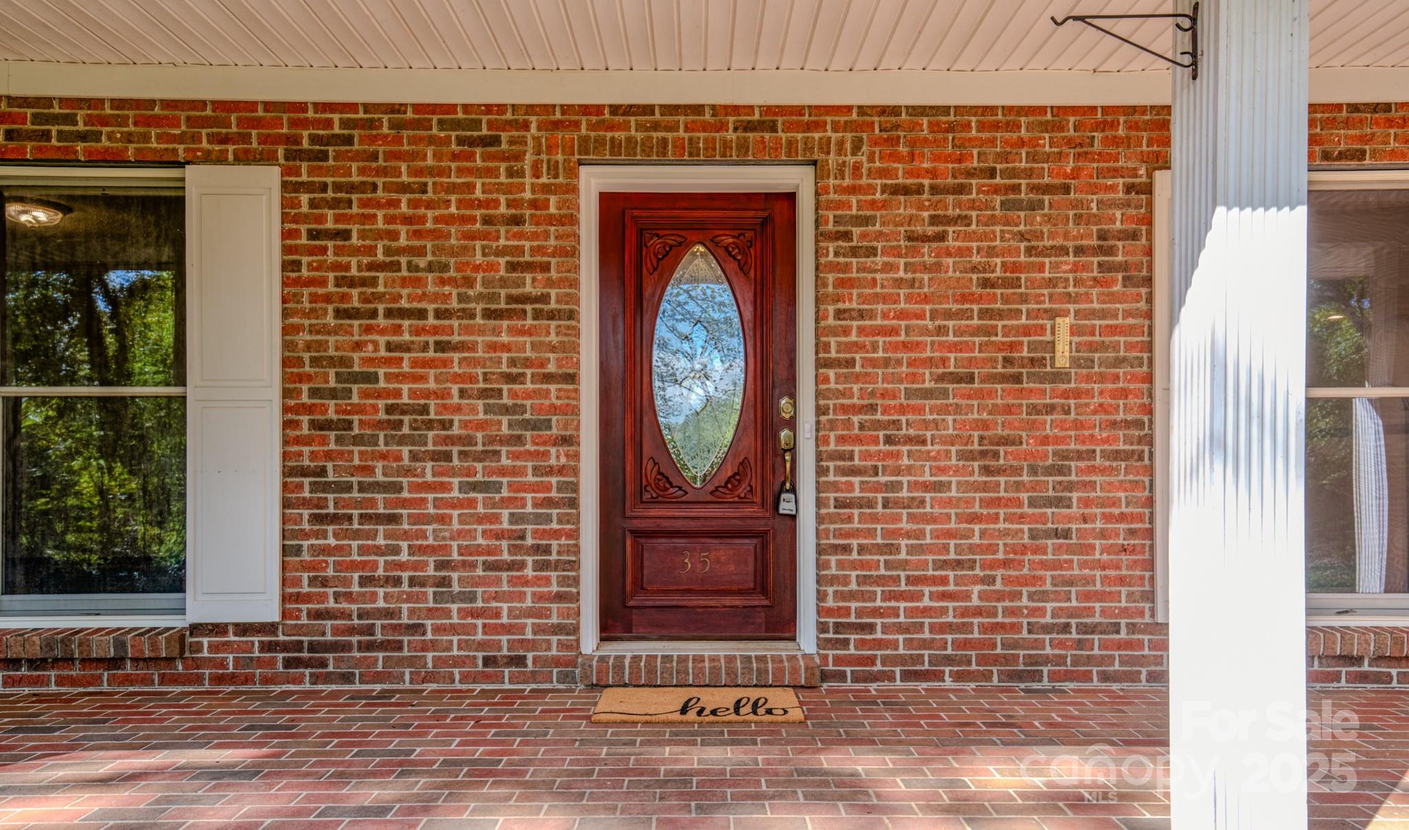 35 Byrd Road Candler, NC 28715 - Photo 7 of 46 a front view of a house with a door
