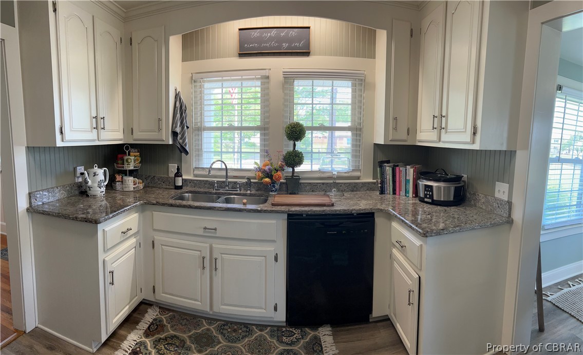 1438 Lafayette Road Gloucester Point, VA 23062 - Photo 12 of 34 Kitchen featuring sink, black dishwasher, dark hardwood / wood-style flooring, and white cabinetry