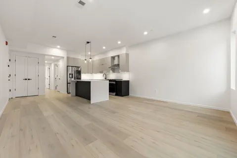 a view of a kitchen with a sink and a microwave