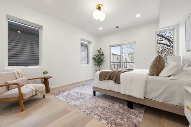 a bedroom with a bed and a couch