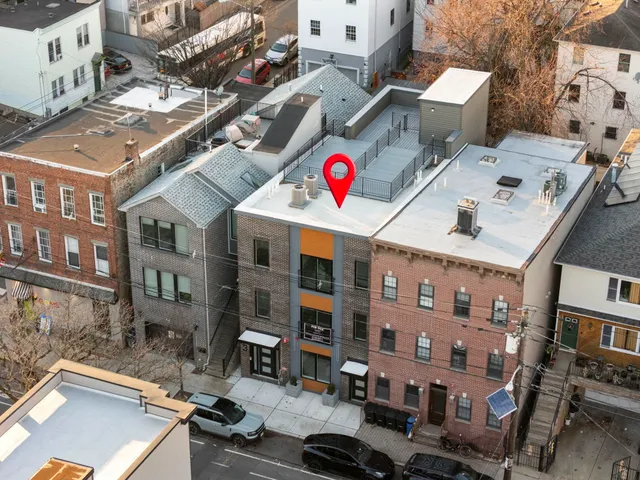 a view of a street with buildings