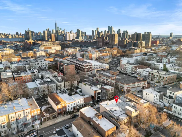 an aerial view of a city with lots of residential buildings