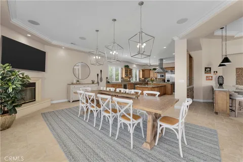 a kitchen with stainless steel appliances granite countertop a sink a oven and a large window