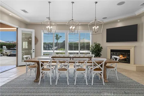 a kitchen with stainless steel appliances granite countertop a sink a stove and a wooden cabinets
