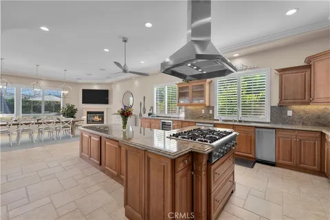 a spacious bedroom with a bed and a flat screen tv