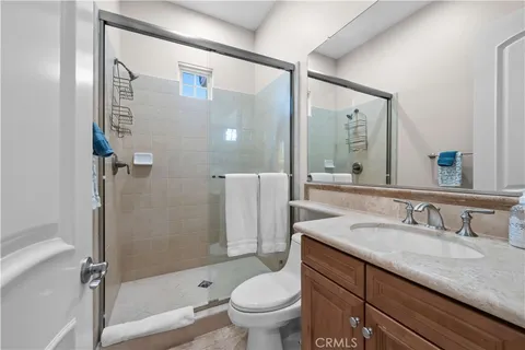 a view of a storage and utility room with washer and dryer