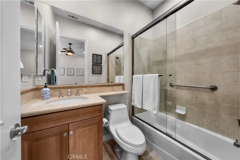 a view of a house with swimming pool and sitting area