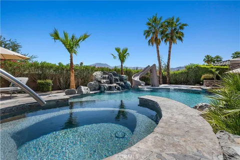 a bedroom with a bed and a lamp