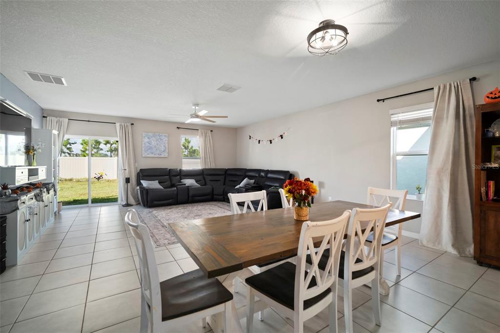 5430 Blue Azure Drive Wimauma, FL 33598 - Photo 13 of 46 a view of a dining room with furniture