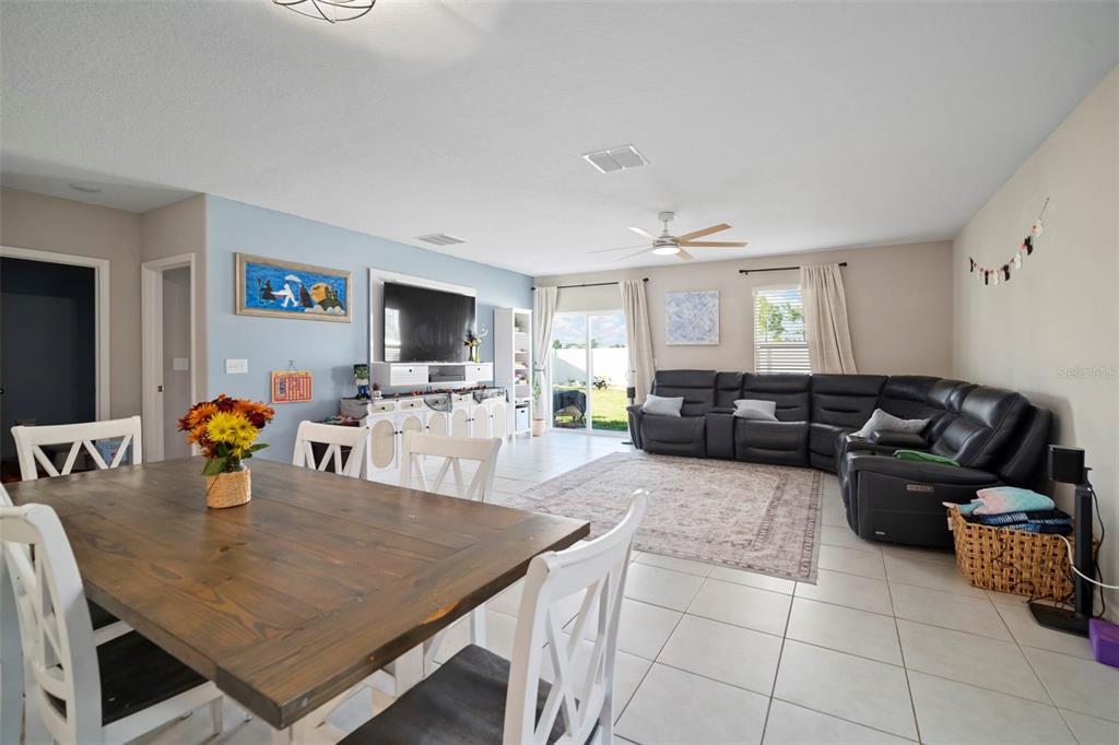 5430 Blue Azure Drive Wimauma, FL 33598 - Photo 14 of 46 a living room with furniture and a flat screen tv