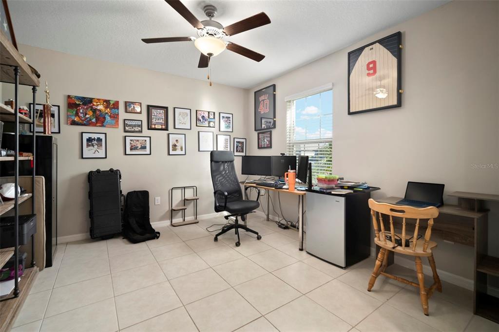 5430 Blue Azure Drive Wimauma, FL 33598 - Photo 19 of 46 a view of a workspace with furniture and a window