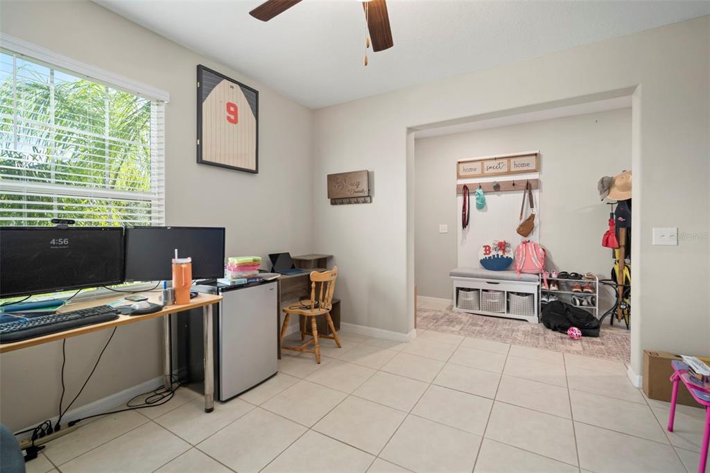 5430 Blue Azure Drive Wimauma, FL 33598 - Photo 21 of 46 a view of a workspace with furniture and a window