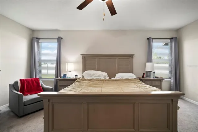 a bedroom with a bed and window