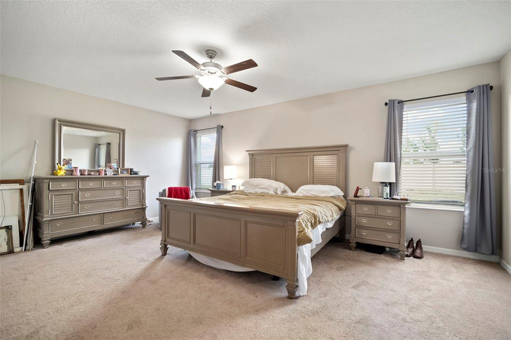 5430 Blue Azure Drive Wimauma, FL 33598 - Photo 24 of 46 a bed room with a bed and a window