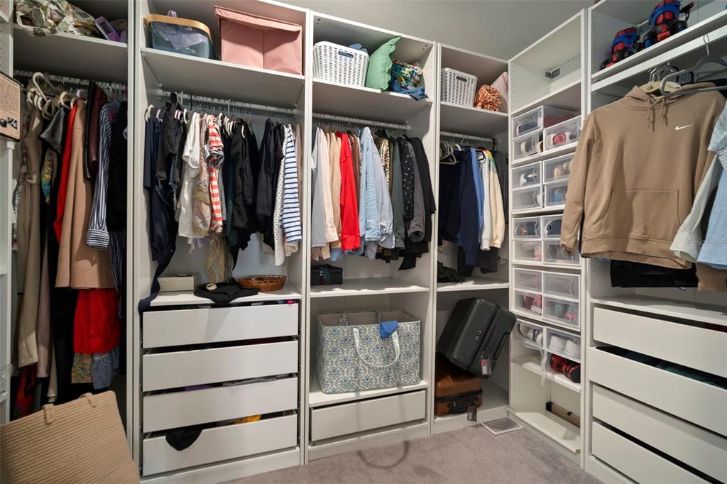 5430 Blue Azure Drive Wimauma, FL 33598 - Photo 27 of 46 a view of walk in closet with clothes and shoes