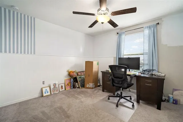 a view of a livingroom with furniture and staircase