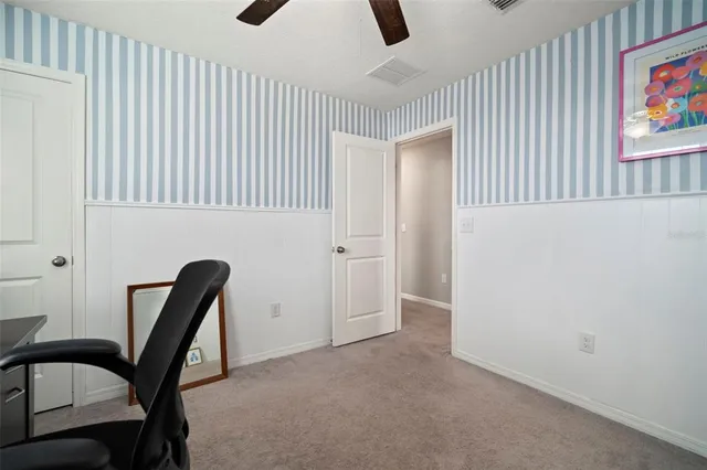 a bedroom with a bed and chair