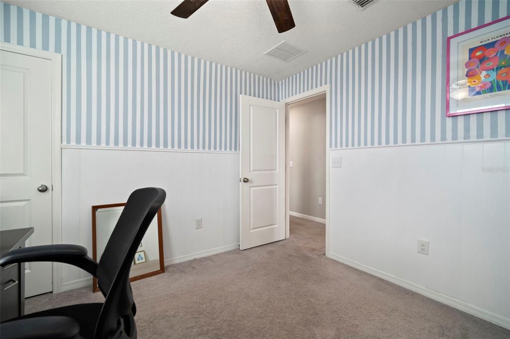 5430 Blue Azure Drive Wimauma, FL 33598 - Photo 42 of 46 a view of a livingroom with furniture and staircase
