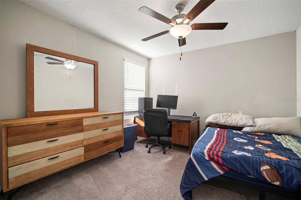 5430 Blue Azure Drive Wimauma, FL 33598 - Photo 45 of 46 a bedroom with a bed and a window