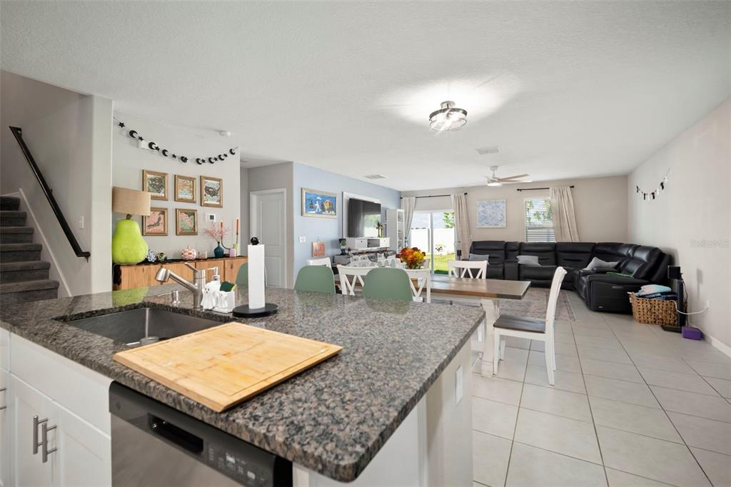 5430 Blue Azure Drive Wimauma, FL 33598 - Photo 10 of 46 a living room with furniture and wooden floor