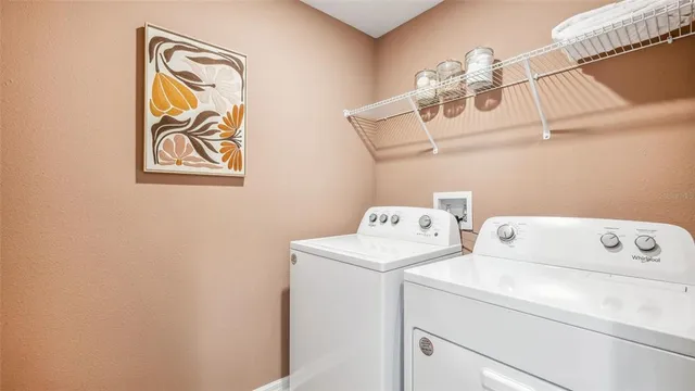 a utility room with dryer and washer