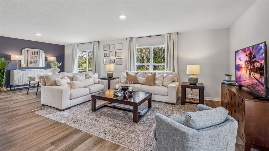 9939 Wimico Terrace Parrish, FL 34219 - Photo 2 of 32 a living room with furniture and a flat screen tv