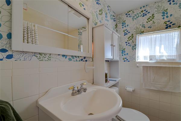 10 Spring Valley Road Natick, MA 01760 - Photo 15 of 17 a bathroom with a sink a toilet and shower