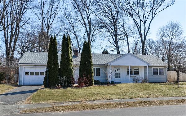 10 Spring Valley Road Natick, MA 01760 - Photo 3 of 17 a front view of a house with a garden