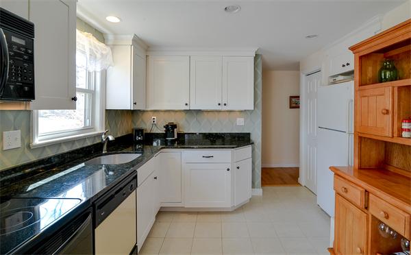 10 Spring Valley Road Natick, MA 01760 - Photo 5 of 17 a kitchen with a sink stove and refrigerator