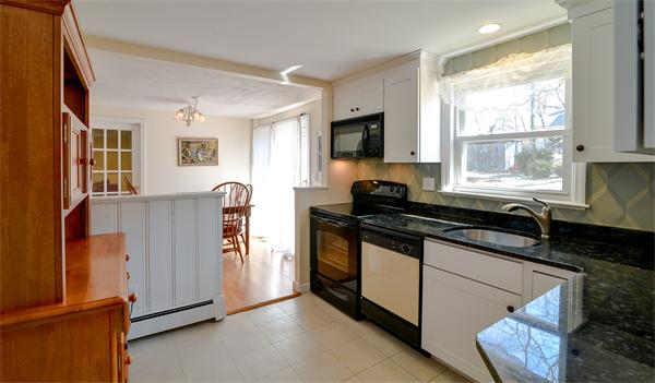 10 Spring Valley Road Natick, MA 01760 - Photo 9 of 17 a kitchen with granite countertop a stove and a sink
