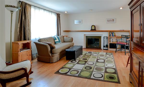 10 Spring Valley Road Natick, MA 01760 - Photo 10 of 17 a living room with furniture and a fireplace