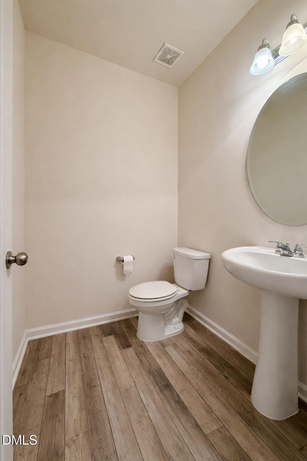 11 Rambler Lane Durham, NC 27703 - Photo 9 of 28 a bathroom with a sink and a mirror