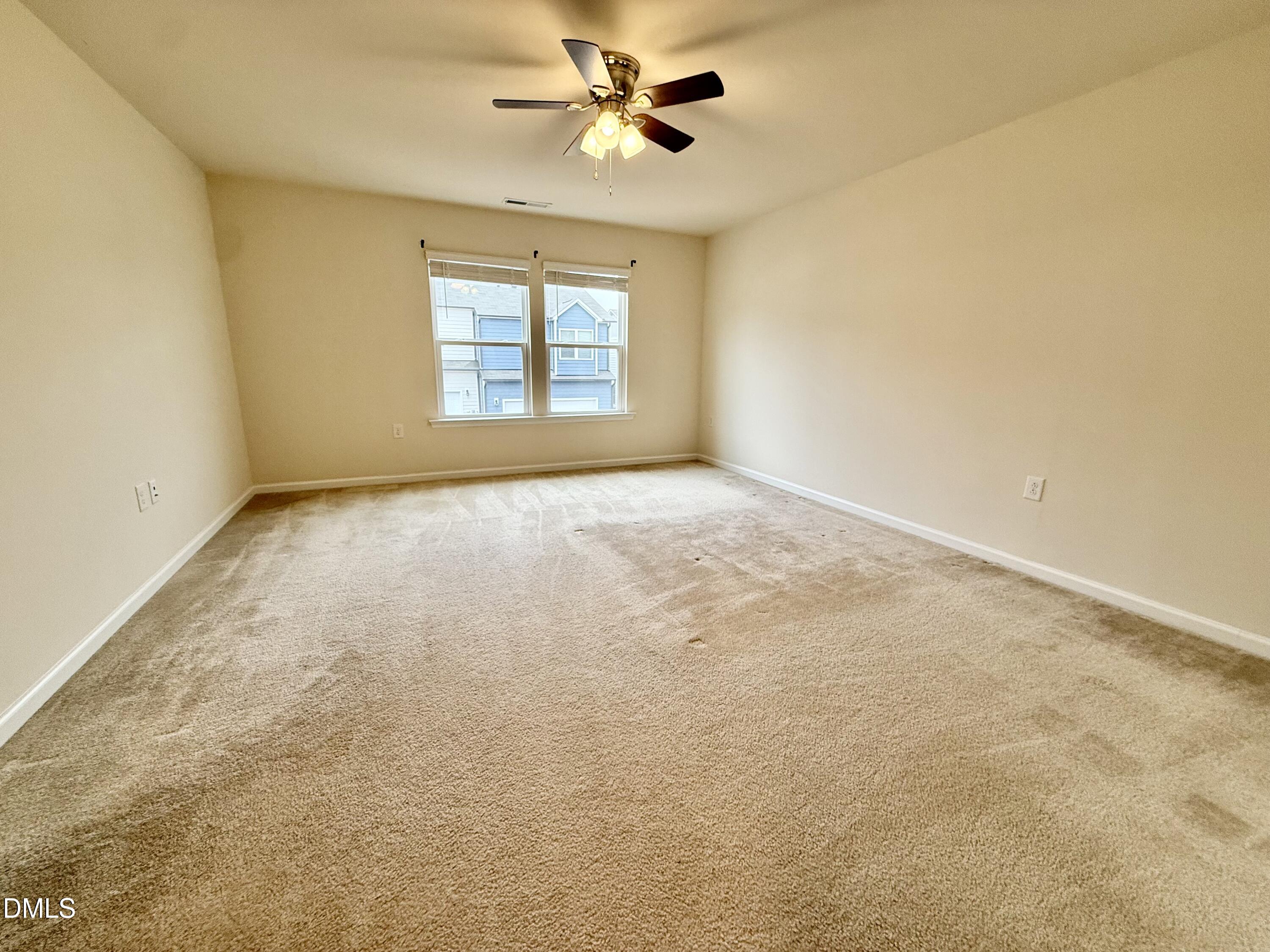 11 Rambler Lane Durham, NC 27703 - Photo 11 of 28 an empty room with windows and fan