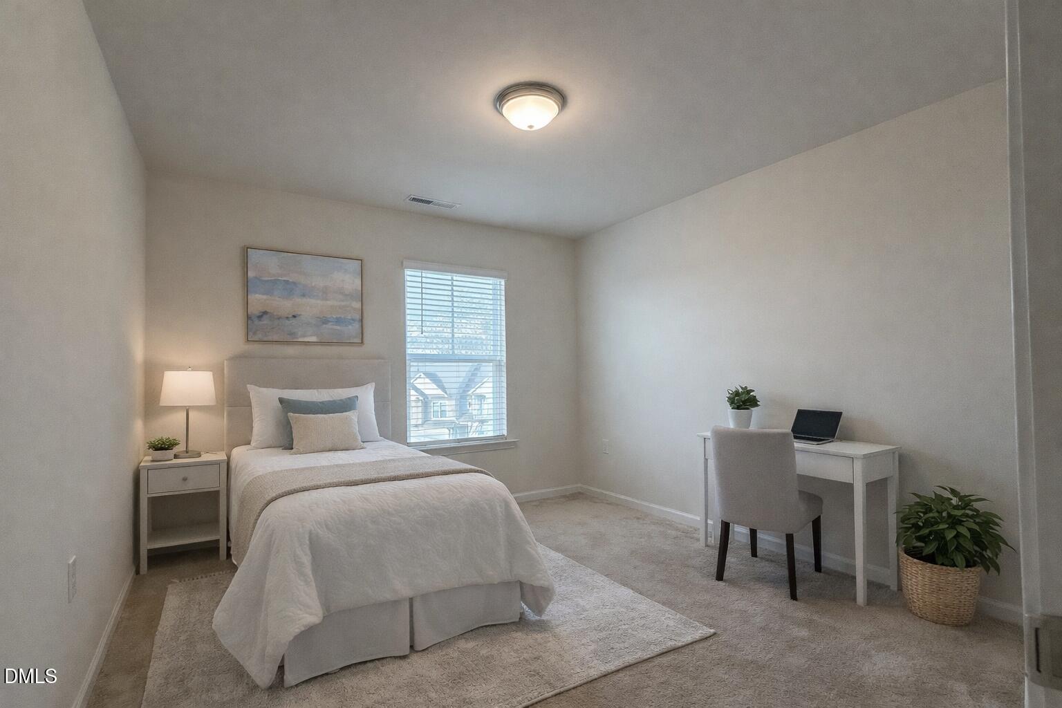 11 Rambler Lane Durham, NC 27703 - Photo 19 of 28 a bedroom with a bed and a chair