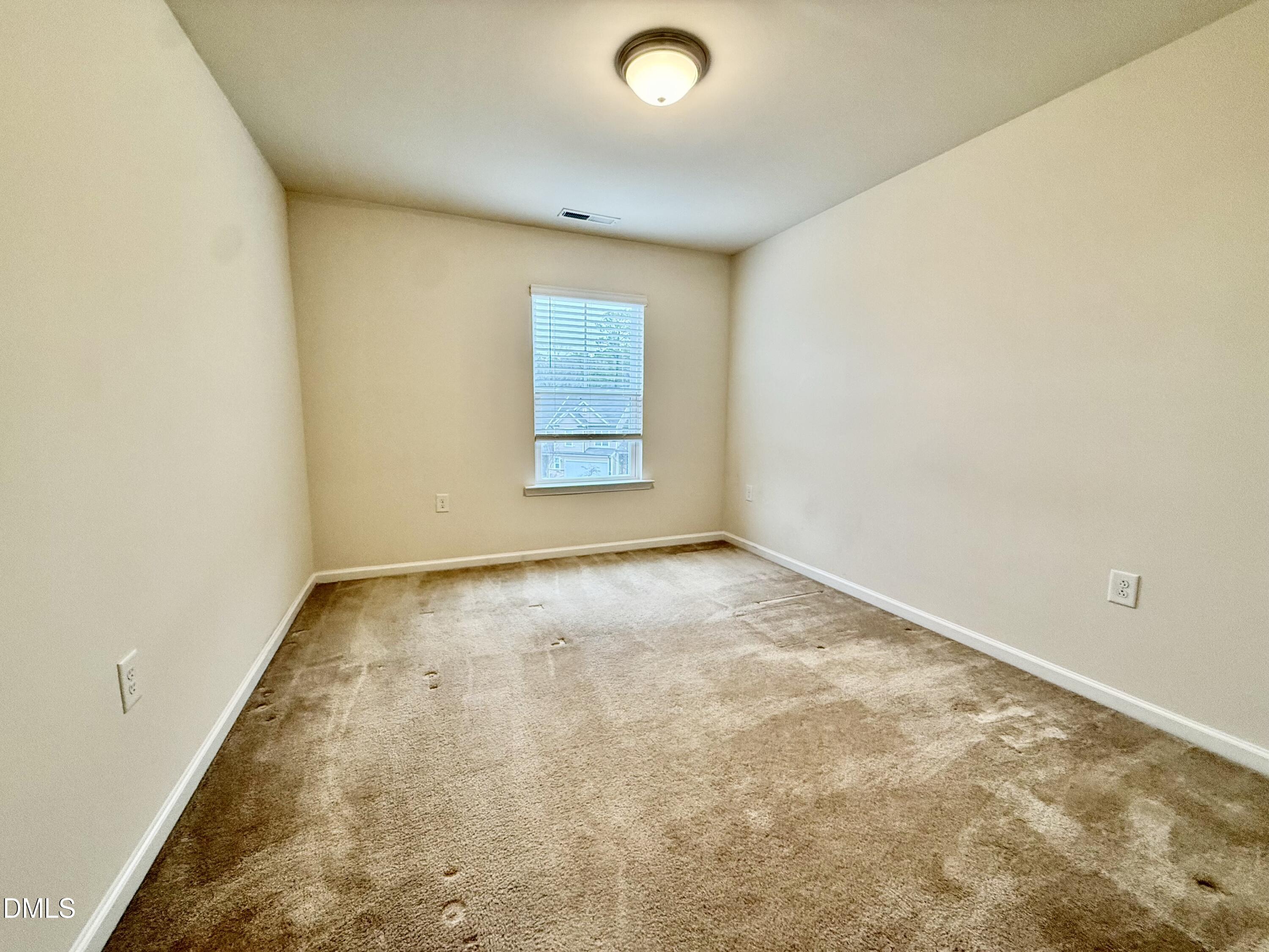 11 Rambler Lane Durham, NC 27703 - Photo 20 of 28 an empty room with a window
