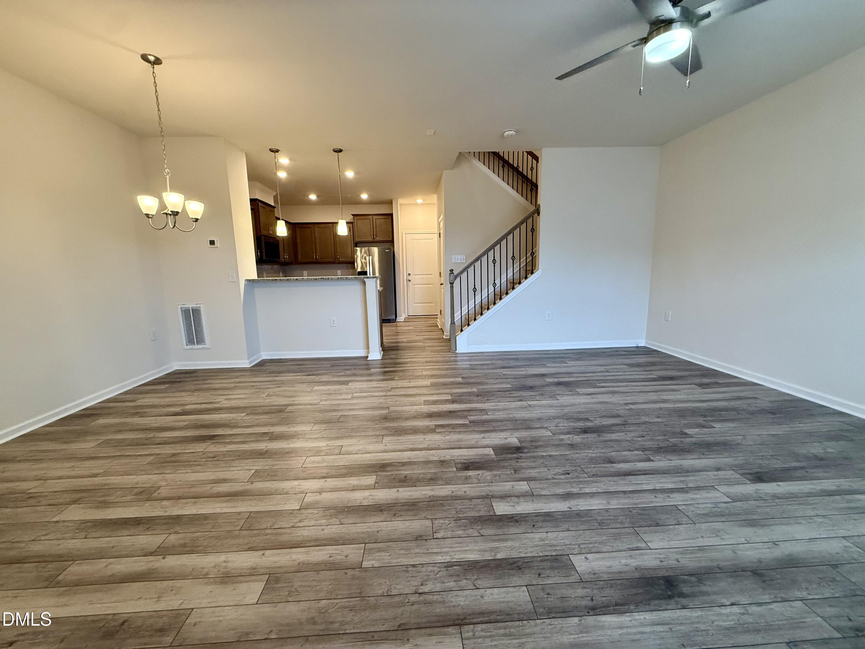 11 Rambler Lane Durham, NC 27703 - Photo 2 of 28 a view of a room with wooden floor and ceiling fan