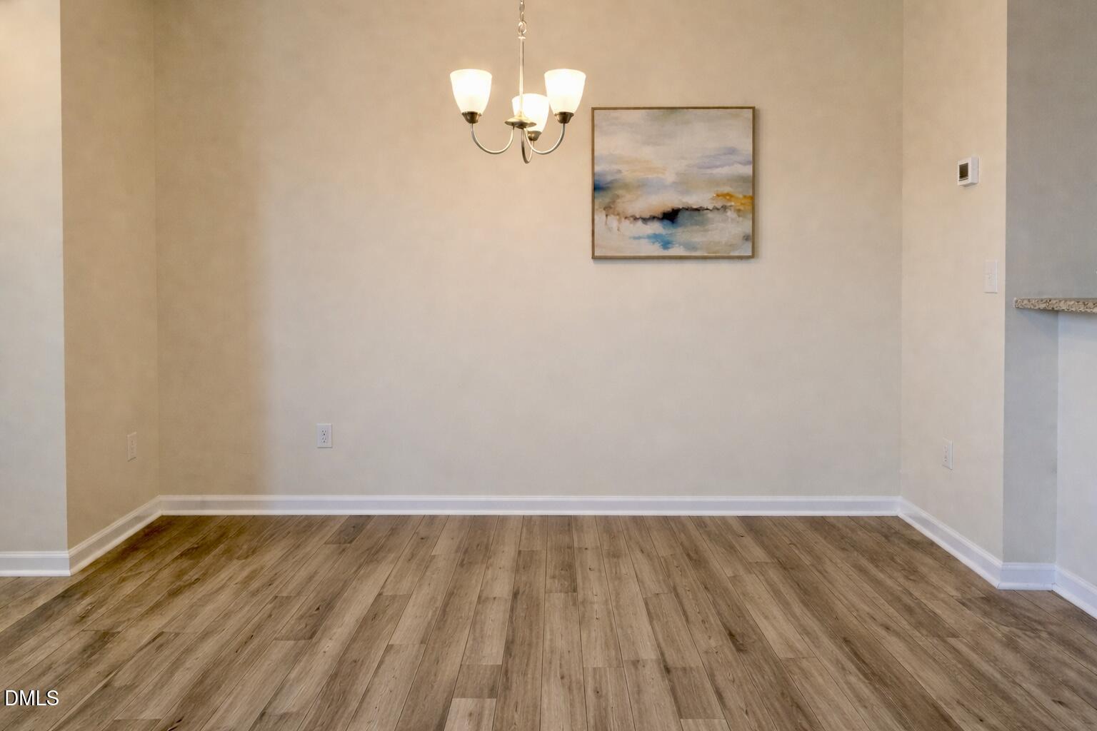 11 Rambler Lane Durham, NC 27703 - Photo 5 of 28 a view of a room with wooden floor