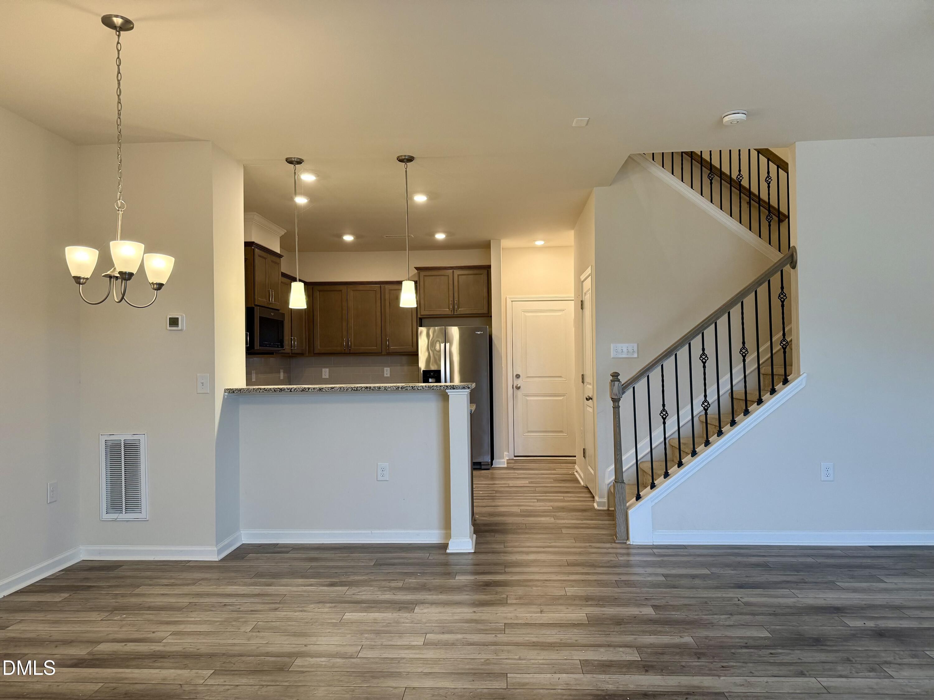 11 Rambler Lane Durham, NC 27703 - Photo 6 of 28 a view of a room with wooden floor and staircase