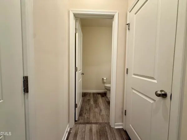 a view of a bathroom from a hallway