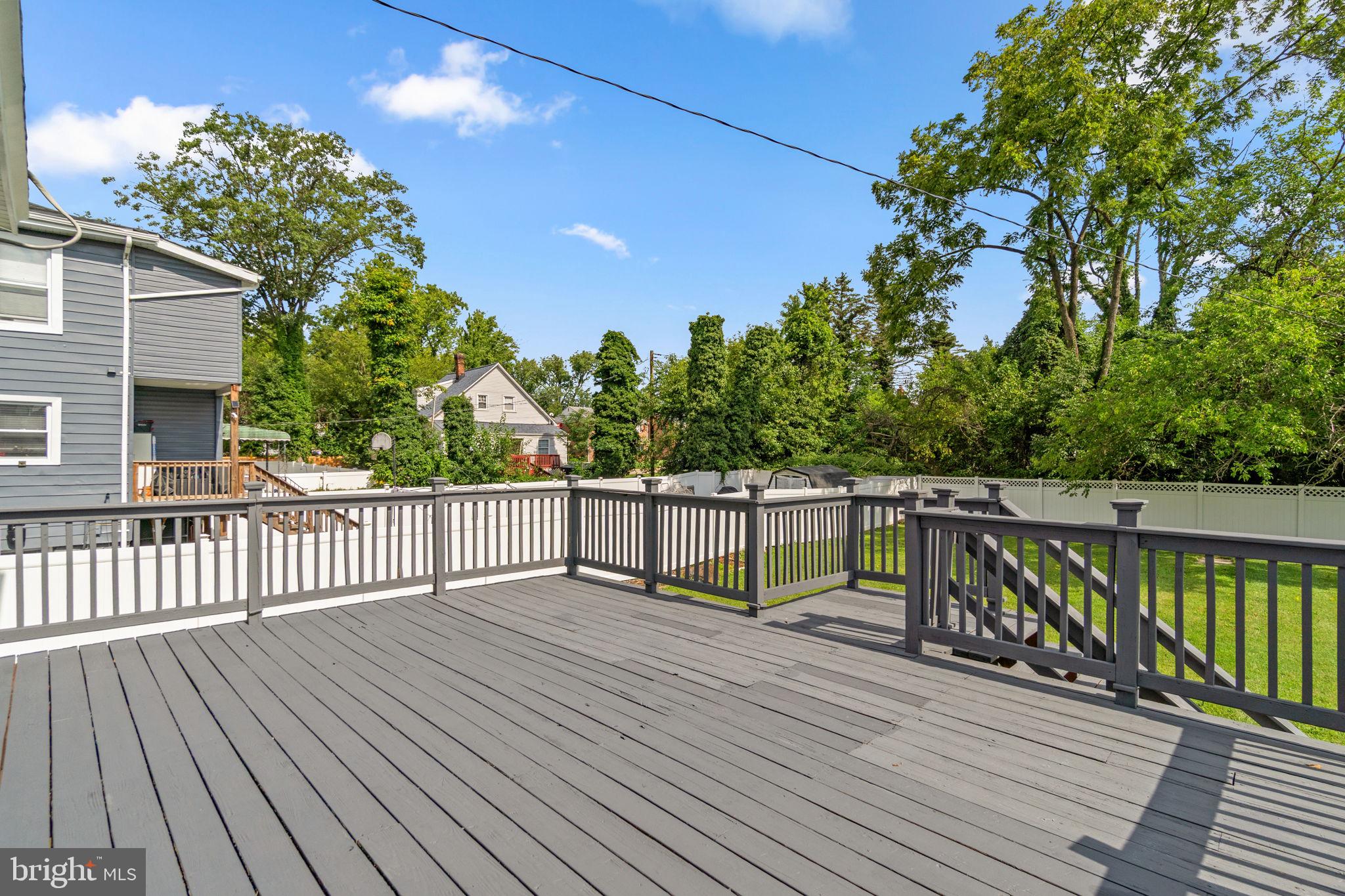 4806 Haddon Avenue Baltimore, MD 21207 - Photo 37 of 43 Spacious deck surrounded by greenery.