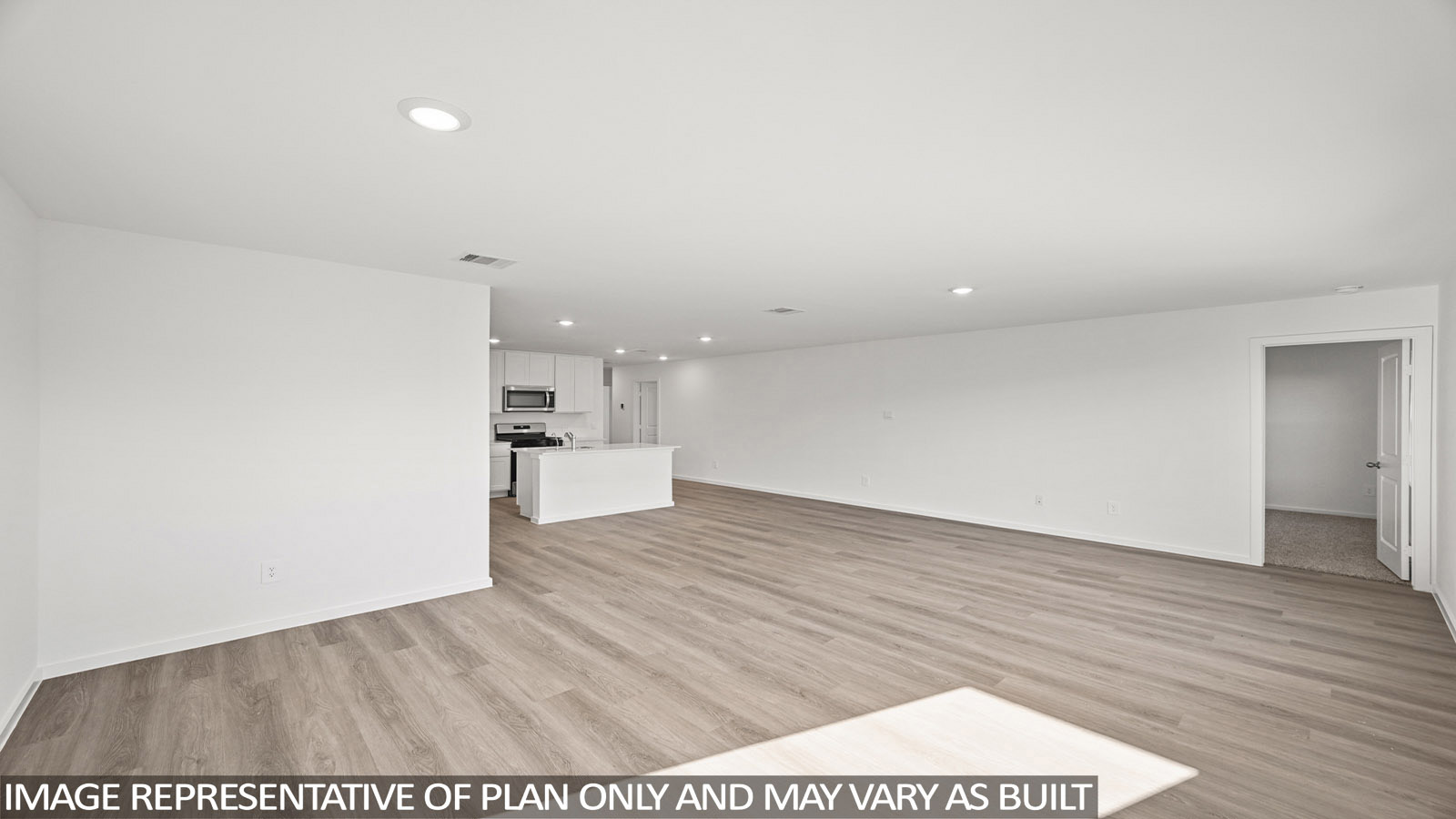 152 Baby Calf Roping Road Jarrell, TX 76537 - Photo 10 of 23 Open-concept living area featuring wood-finish flooring, recessed lighting, and a white color palette