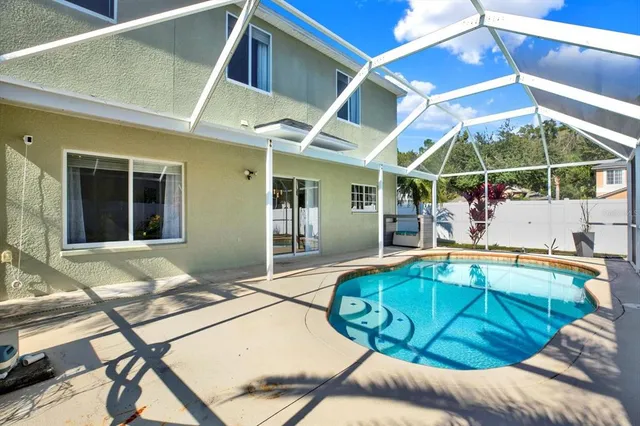a view of a house with swimming pool