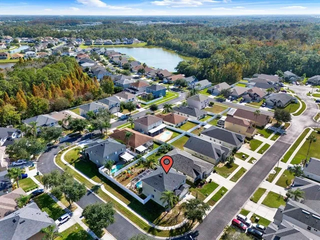 an aerial view of residential houses with outdoor space