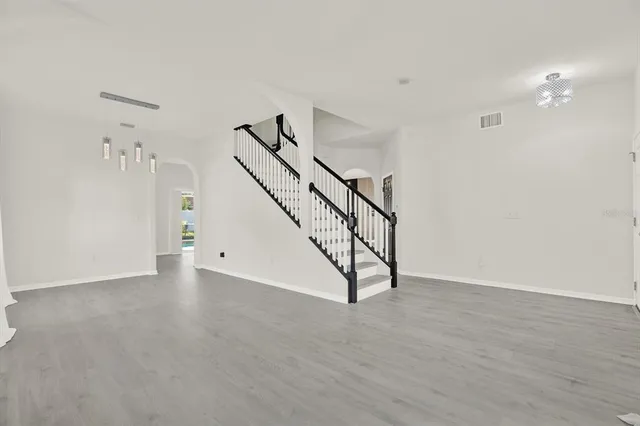 a view of an empty room with stairs