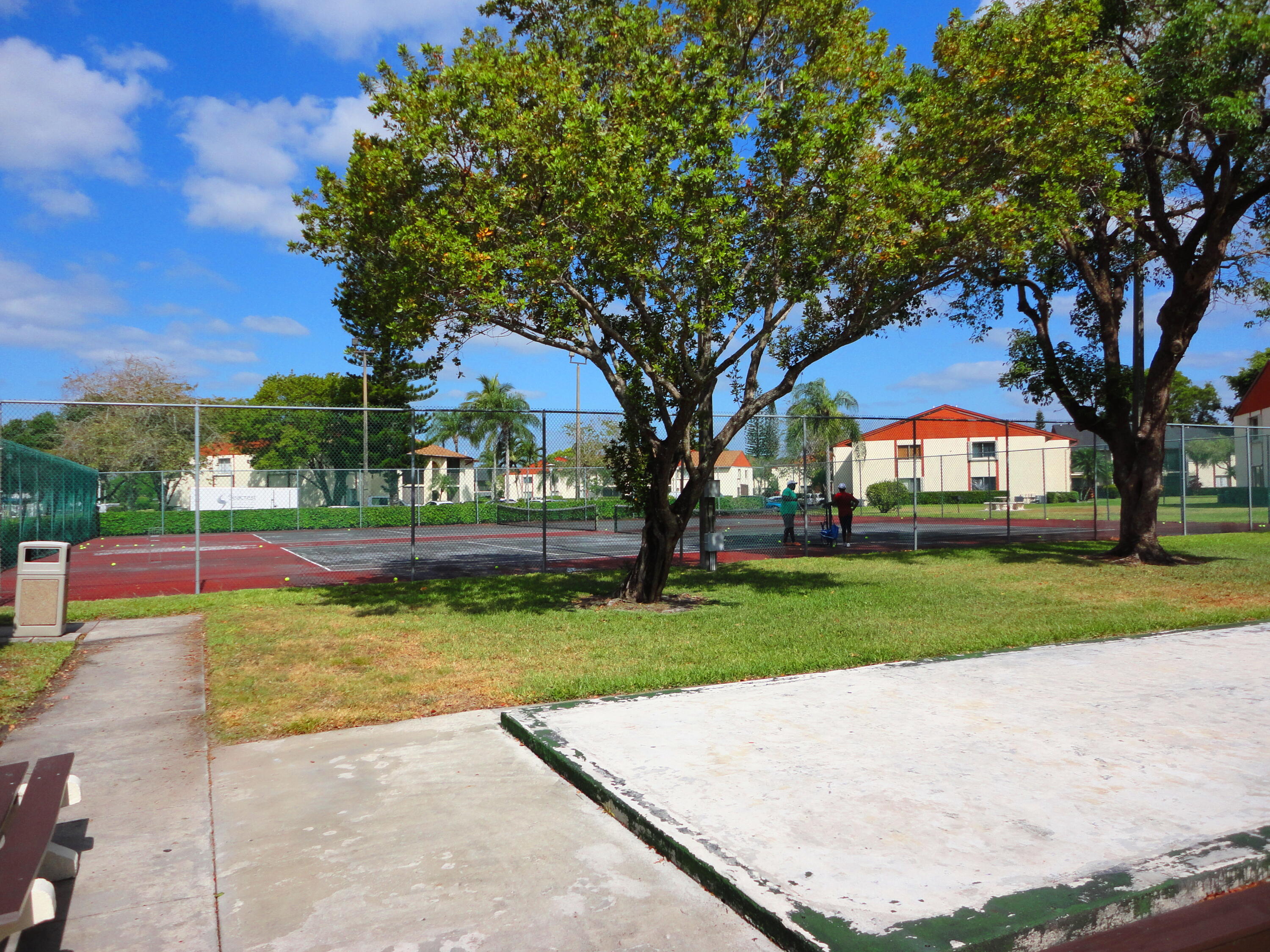 4695 Sable Pine Circle, Unit C2 West Palm Beach, FL 33417 - Photo 13 of 14 a view of a park with large trees