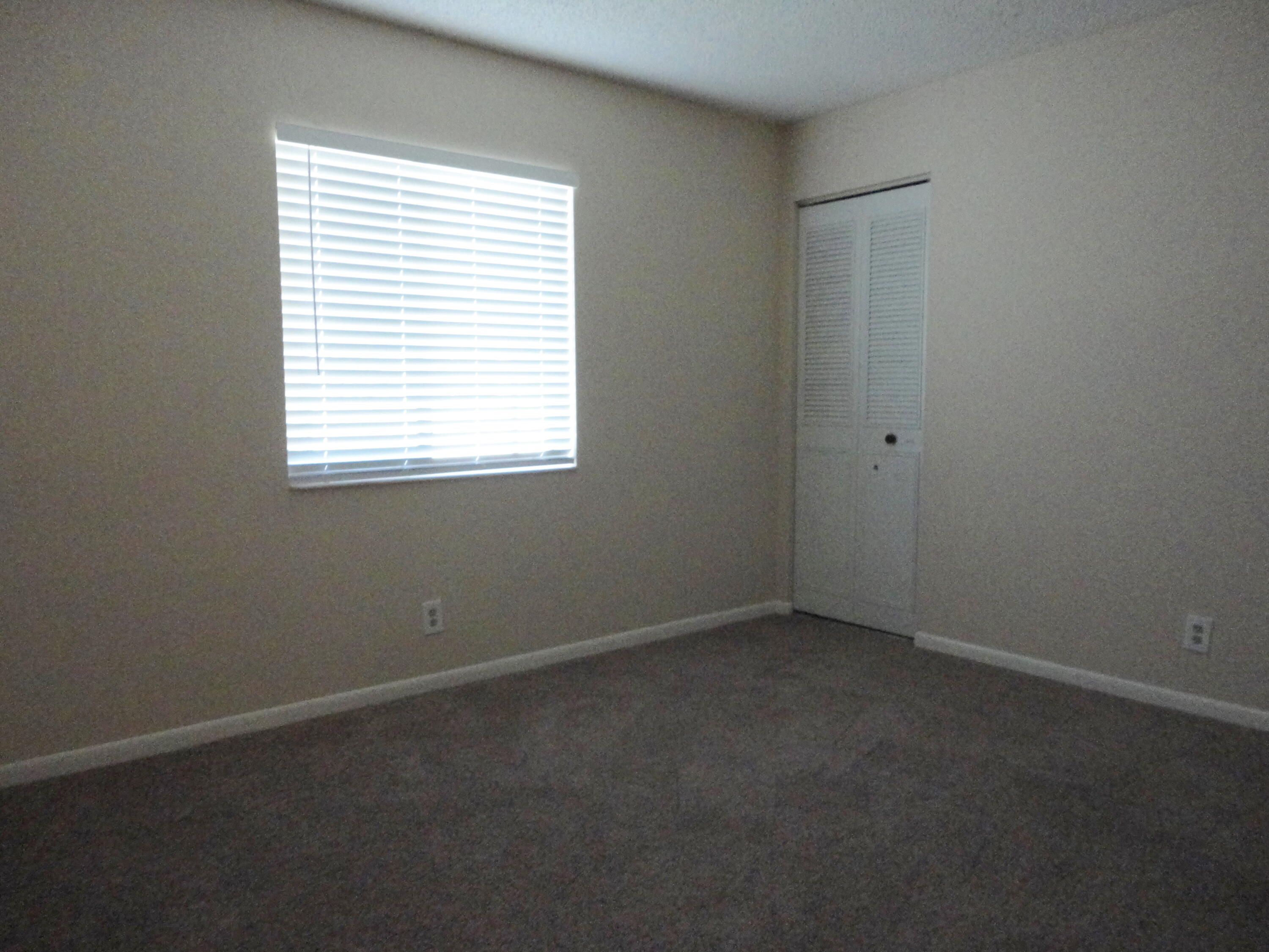 4695 Sable Pine Circle, Unit C2 West Palm Beach, FL 33417 - Photo 7 of 14 an empty room with a window