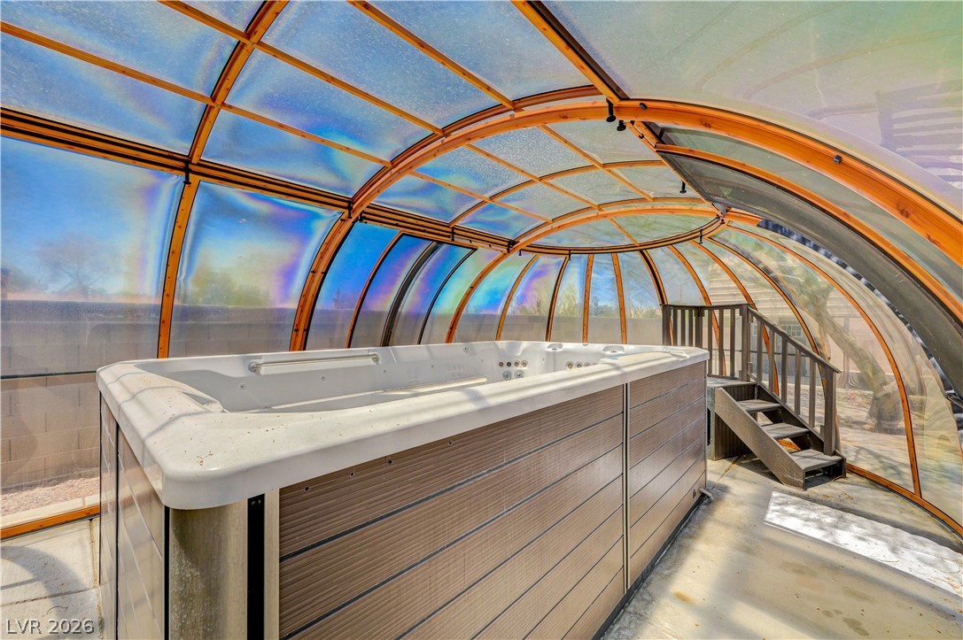 7631 Bermuda Road Las Vegas, NV 89123 - Photo 39 of 64 An enclosed spa with a retractable dome roof offers a private relaxation oasis.