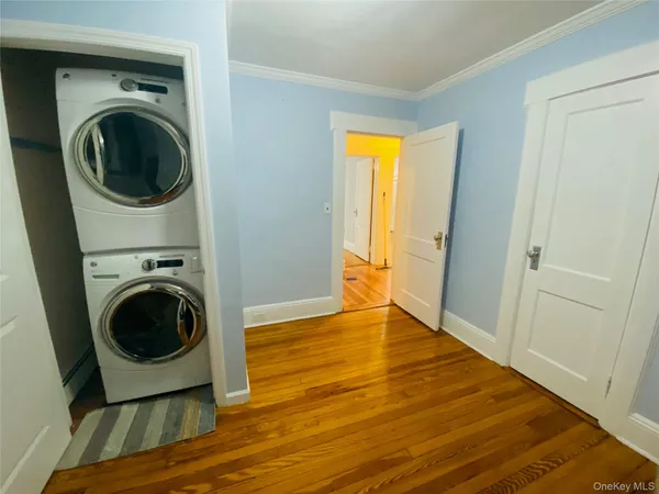 a view of a hallway with washer and dryer