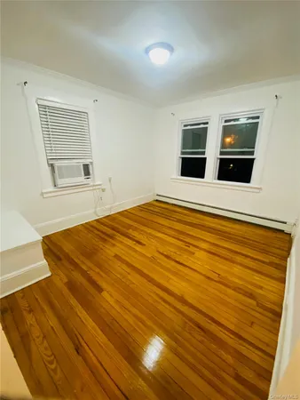 a bedroom with a bed and cabinets